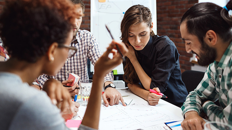 Application-of-principles-to-searches-for-PRCommunications-agencies Diverse group of people having a discussion at table