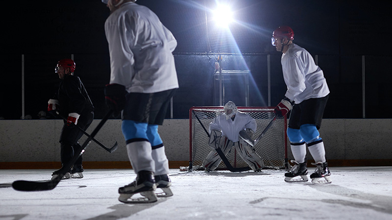 Group of people playing ice hockey