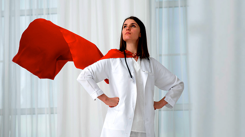 Tim-Hortons-pays-tribute-to-Canadian-heroes-of-the-pandemic Female doctor standing in a hero pose with a cape