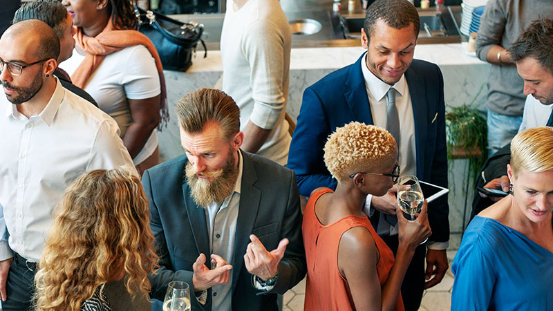 Corporate-Sponsorship-Opportunities Diverse group of men and women at corporate party event